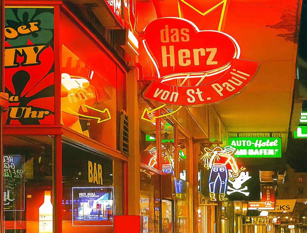 Neon signs of St. Pauli glowing at night